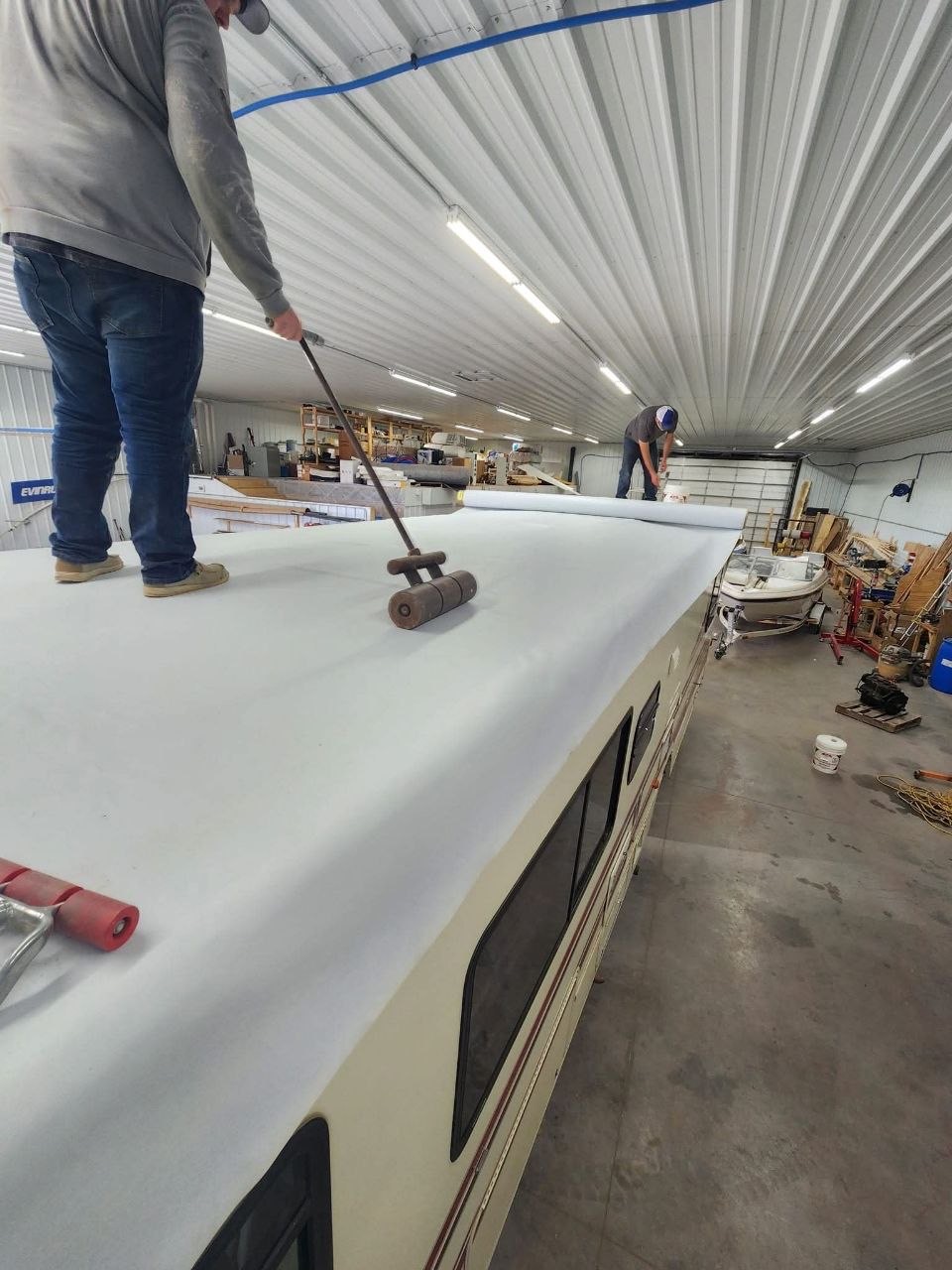 Roof membrane being pressed into place