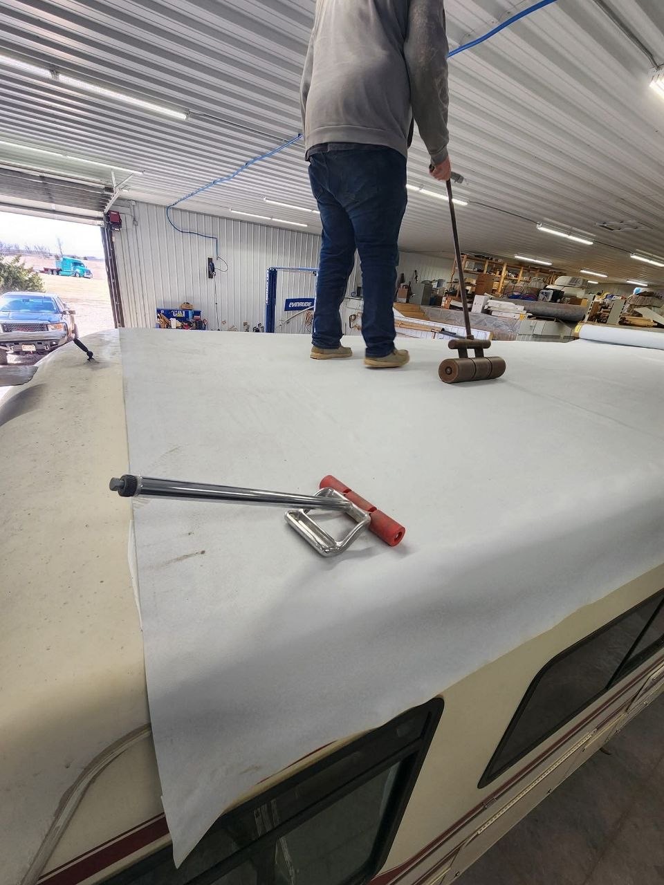 New roof membrane being rolled into position