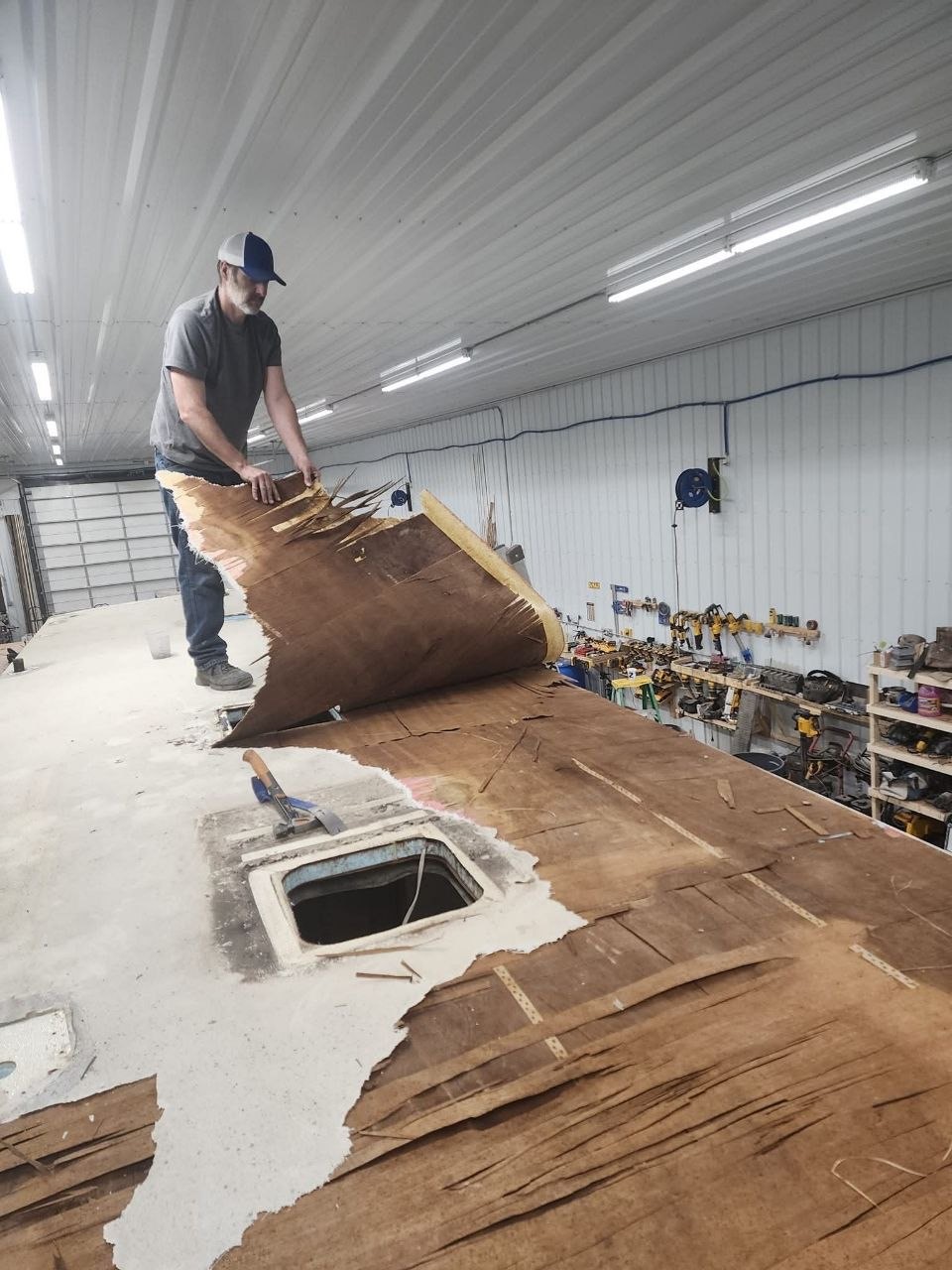 Removing damaged roof decking from the Winnebago